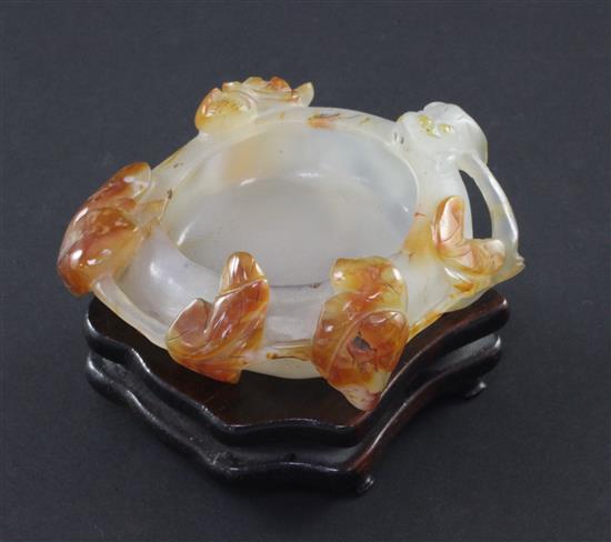 A Chinese chalcedony brush washer, 19th / 20th century, 8.4cm, wood stand